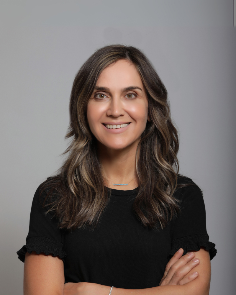 Portrait of Dr. Tala Khalaf, Co-Founder and CEO of TheraFascia, alongside her biography detailing her experience in fascia manipulation and orthopedic physical therapy.